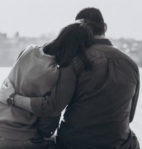 Two People Grieving Over Loss Of Dad