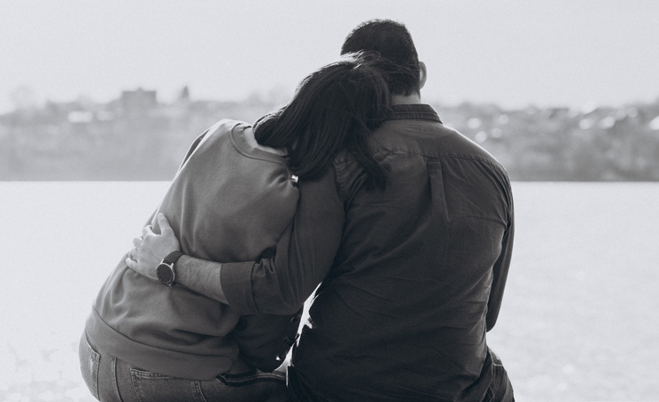 Two People Grieving Over Loss Of Dad