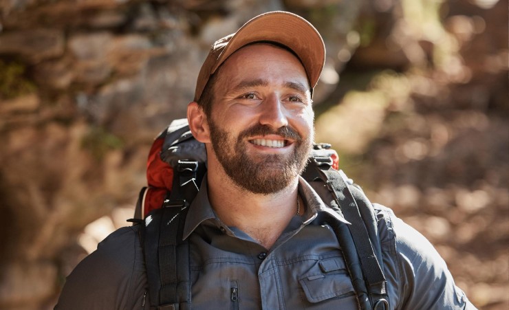 An Outdoorsy Man Smiling