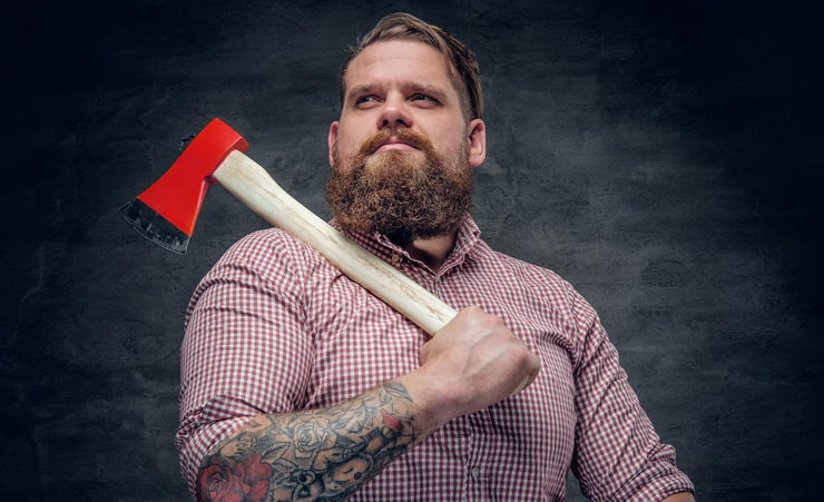 Man Carrying A Hatchet