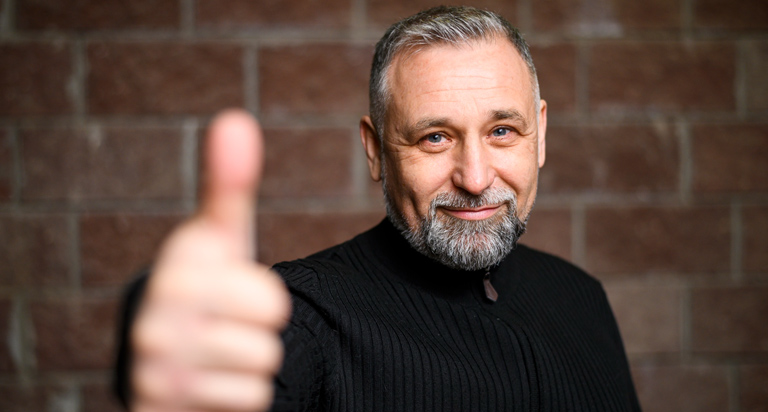 Older Man With Thumbs Up