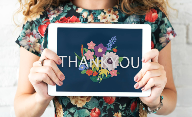 Woman Holding Thank You Sign