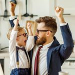 Father At Home Working With Kids