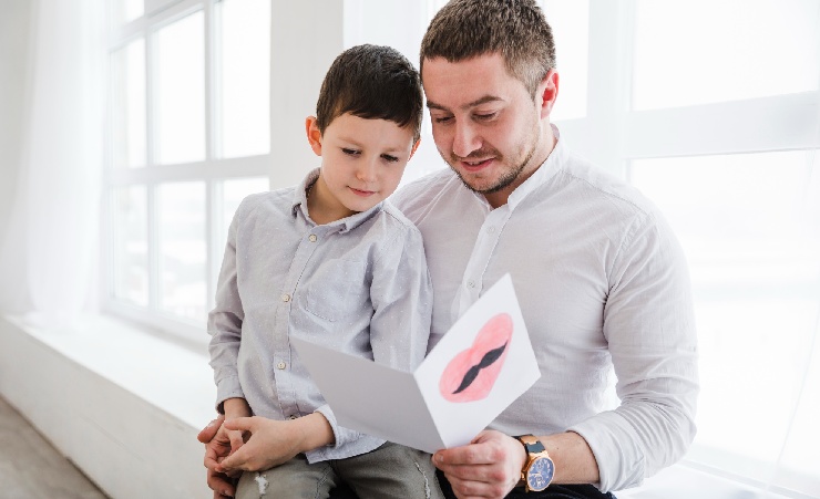 Father Reading Card From Son