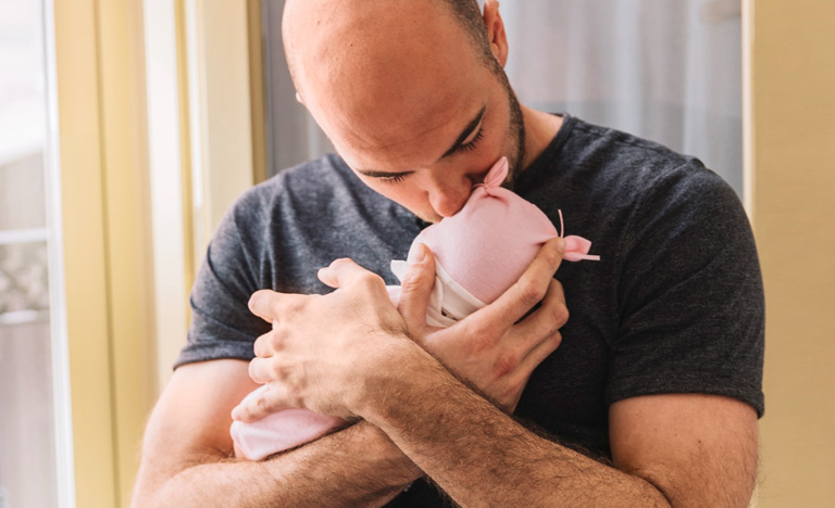 First Time Dad Kissing New Born