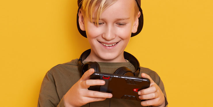 Kids Gaming On Phone With Headphone