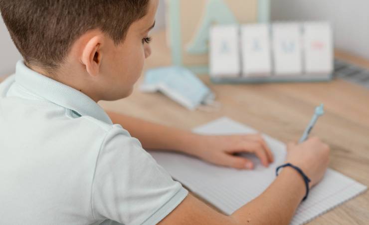Boy Writing On Paper 1