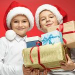 Boys Holding Christmas Gifts Smiling