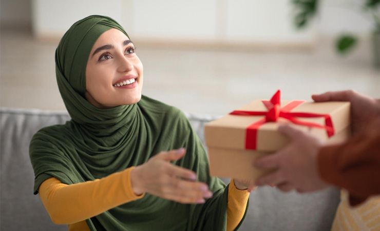 Muslim Woman Accepting Christmas Gift