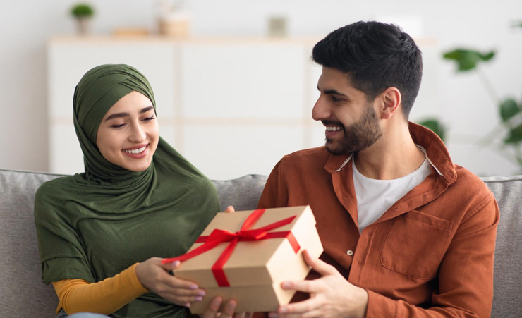 Muslim Woman Accepting Gift From Friend