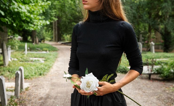 Woman Holding Flower Memorial Service