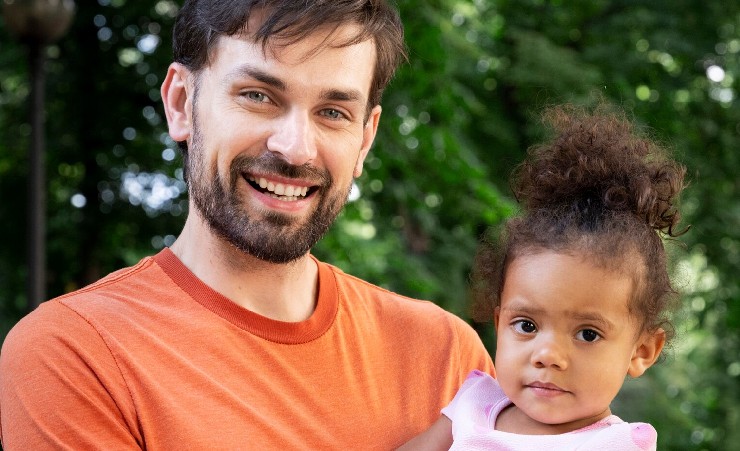 Dad With Daughter Holding