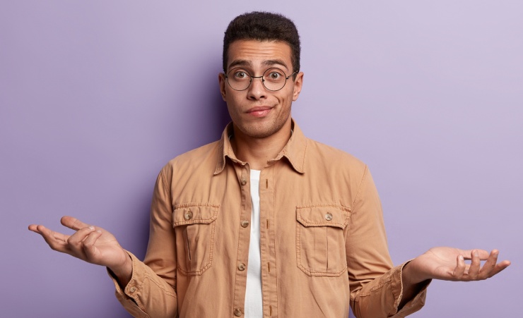Man Unsure What To Do Shrugging