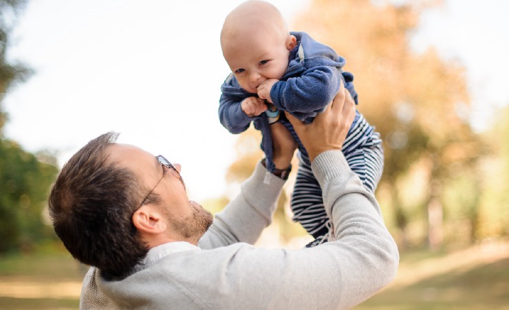New Dad Holding Baby