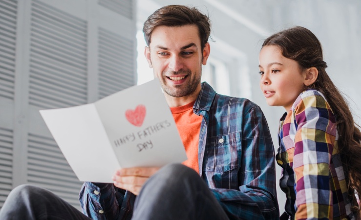 Father Reading Card From Child