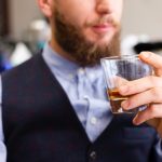 Man Drinking From Whisky Glass