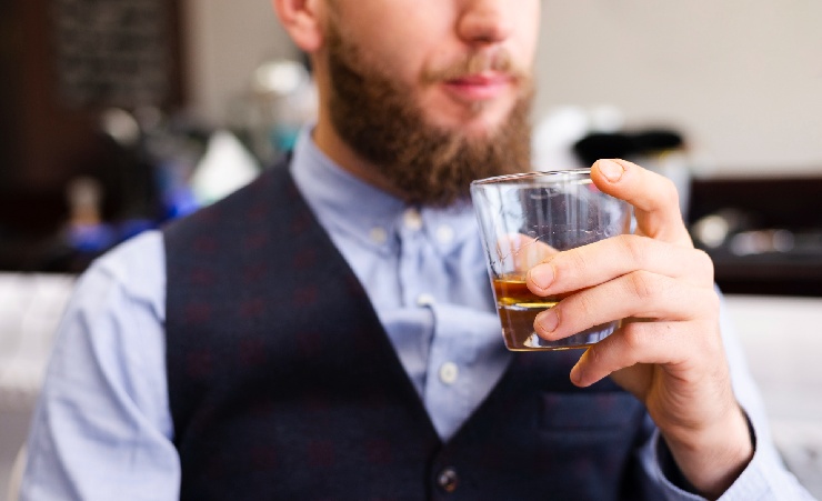 Man Drinking From Whisky Glass