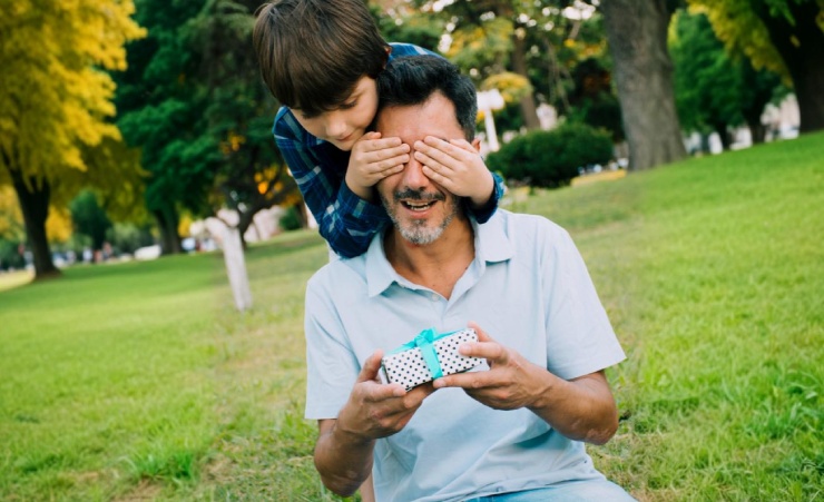 Son Giving Surpise Gifts To Father