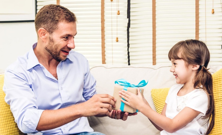 Father Receiving Gift From Daughter