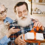 Grandad Opening Christmas Gift