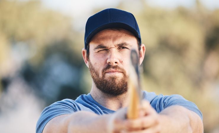 Man Aiming To Throw Axe