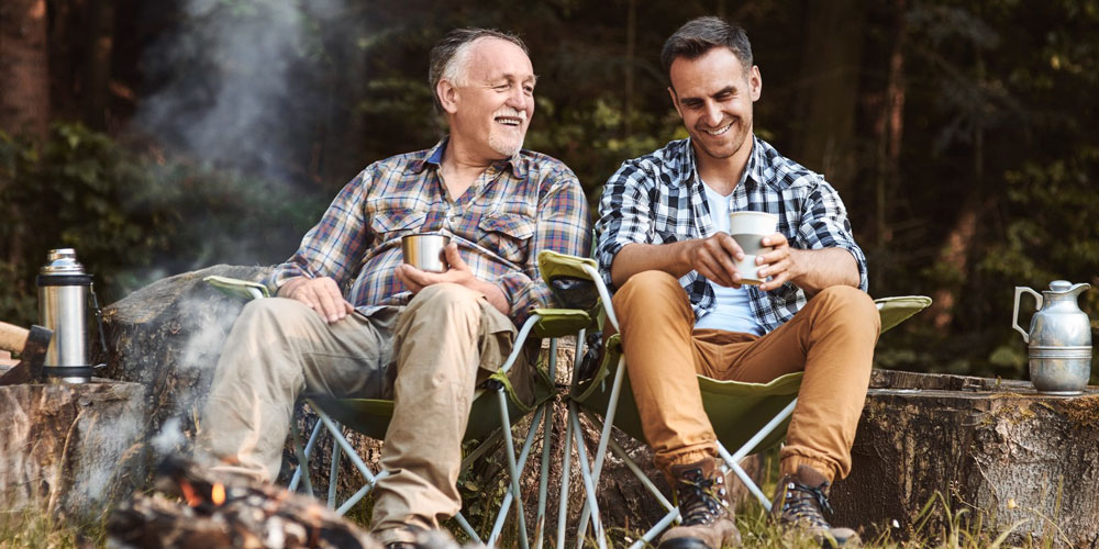 camping outdoors father and son