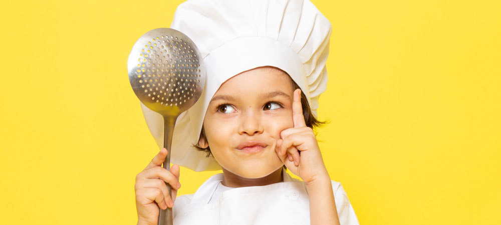 child in cooking outfit