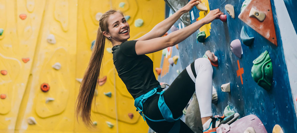 girl indoor rock climbing