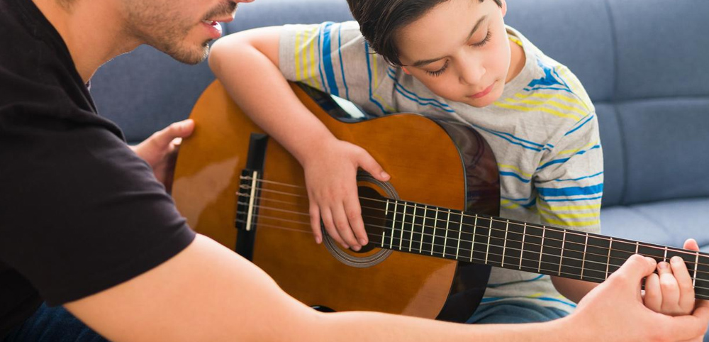 Giving Lessons On A Guitar