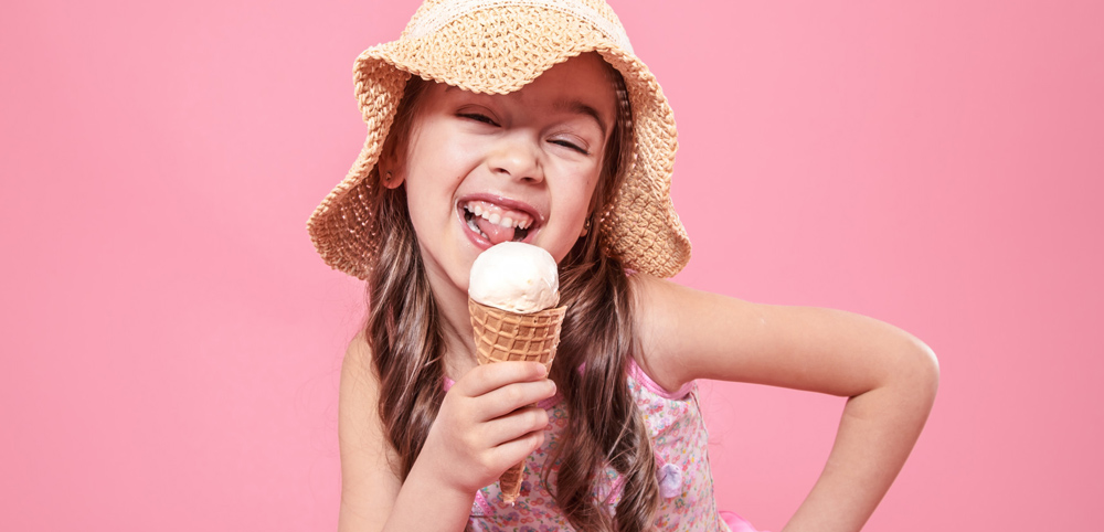 Little Girl Licking An Ice Cream