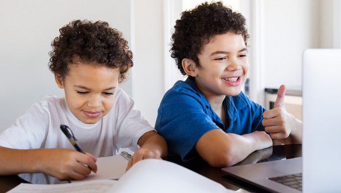 Brothers Doing Homework Relaxed